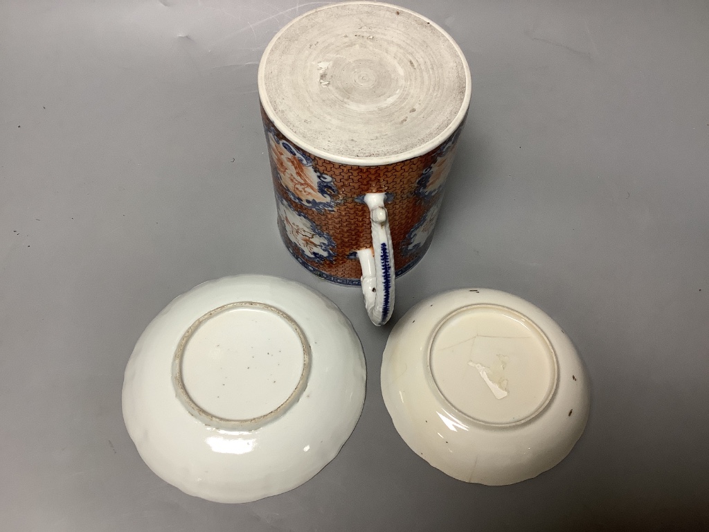 An 18th century Chinese export tankard and two 18th/19th century saucer dishes, tallest 13cm